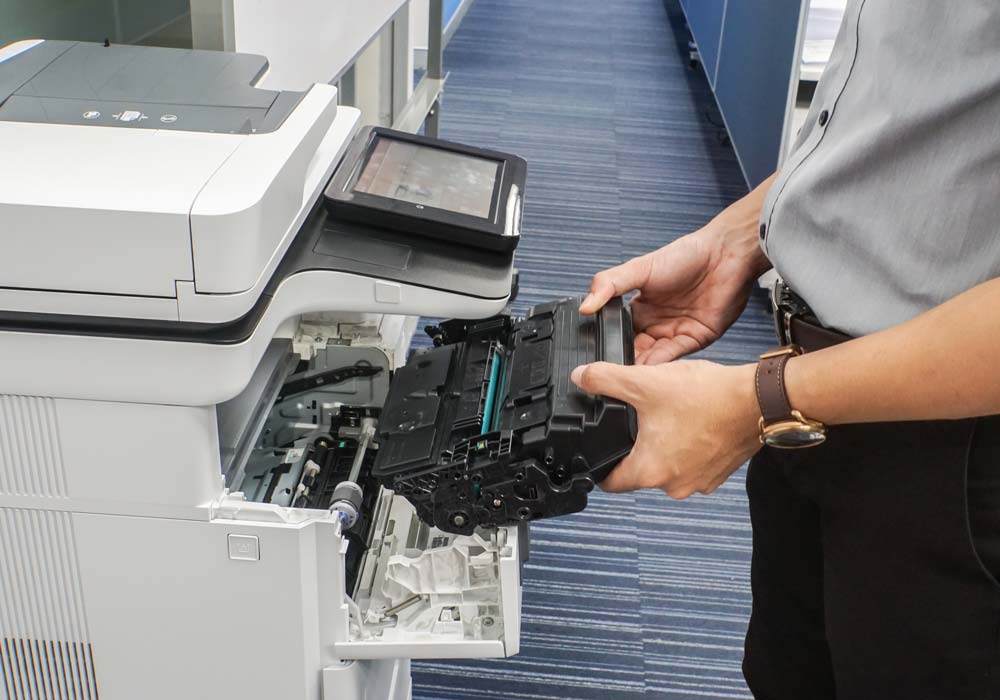 Man installing toner