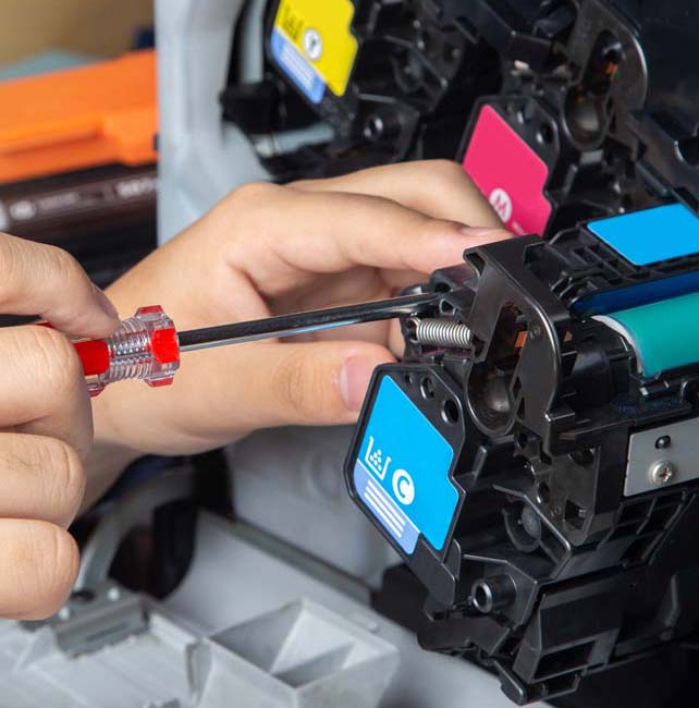 Man repairing printer toner